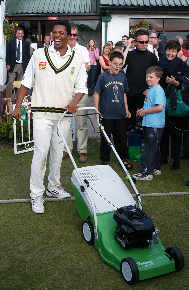 Makhaya Ntini with his lawnmower (© Rowland White)