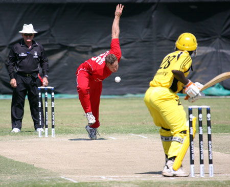 Henrik Hansen bowling in Denmark's victory over Uganda