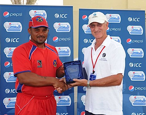 Bermuda's Jason Anderson receives the man of the match award from Dayle Hadlee (ICC/Ian Jacobs)