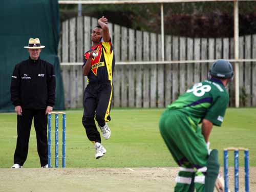 Norman Vanua bowling for Papua New Guinea in their victory over Ireland