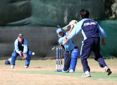 Finland v Greece 2012: Bilal Khan of Finland bowls Nik Pothas