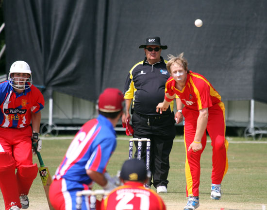 Luke Lacey bowling against Jersey in the 2013 European Division 1 tournament