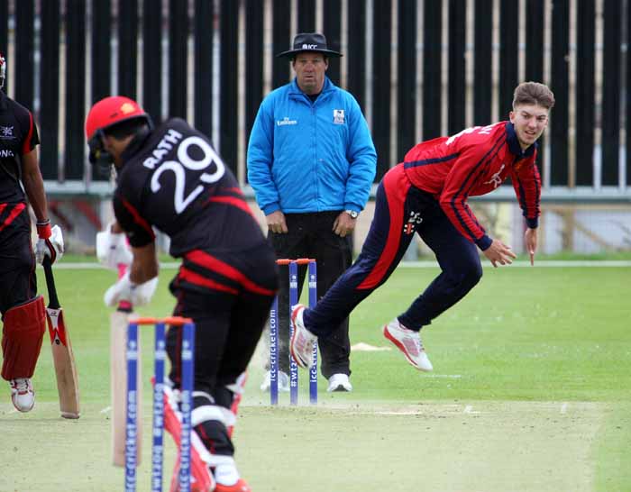 Ben Knyman bowling in Jersey's opening match win against Hong Kong