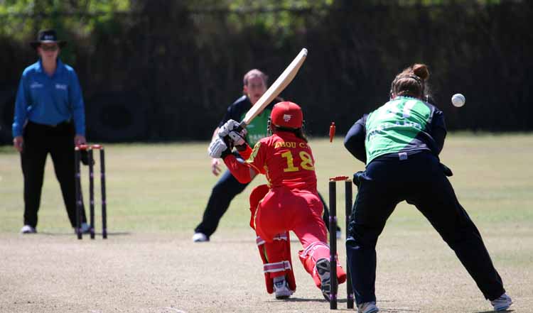 China's Zhou is bowled by Isobel Joyce of Ireland