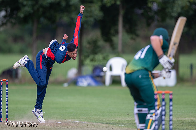 Junaid Sheikh bowling against Guernsey in the 2018 European Division 1 tournament