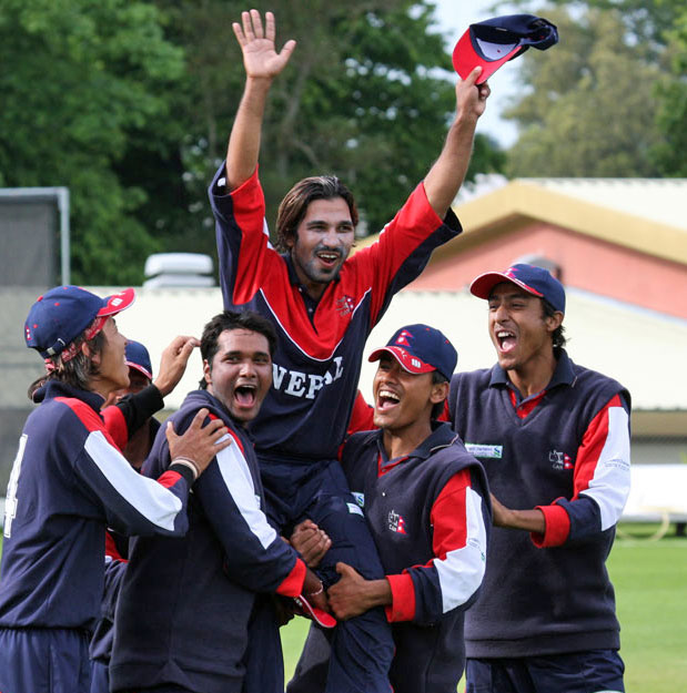 Being carried off the field by his jubilant team mates.