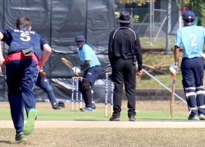 Solomon Nash runs in to bowl during the Fiji innings