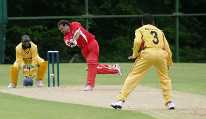 Aftab Ahmed of Denmark is bowled by Uganda's Nehal