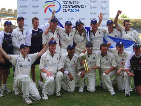 The Scotland squad celebrate winning the trophy