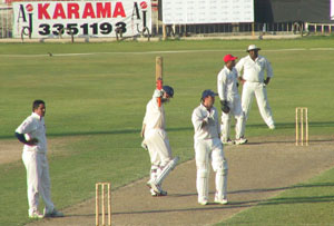 Douglas Lockhart reaches his fifty against Canada